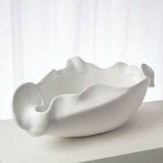 a white bowl sitting on top of a table