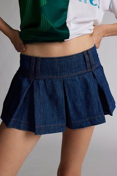 Reinvented Kimchi Blue denim short with a pleated, preppy twist. Designed with a low-rise, elasticated-back waistband and pleated legs in a micro mini length. Only at Urban Outfitters. Features Kimchi Blue Blaire pleated denim micro short Pleated micro short Rigid denim that softens with wear Low rise waist with wide band and belt loops Flare pleated leg A-line silhouette Micro mini length Pull-on style UO exclusive Content + Care 100% Cotton Machine wash Imported Size + Fit Model in Indigo is 5’10" and wearing size Small Measurements taken from size Small Inseam: 1" | Kimchi Blue Blaire Pleated Denim Micro Short in Indigo, Women's at Urban Outfitters Cute Concert Outfit Ideas, Blue Mini Skirt Outfit, Mini Pleated Skirt Outfit, Pleated Skirt Outfit Short, Cute Concert Outfits, Denim Pleated Skirt, Pleated Denim Skirt, Pleated Skirt Outfit, Mini Pleated Skirt