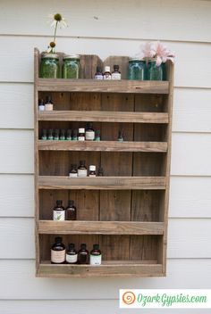 a wooden shelf with jars and bottles on it