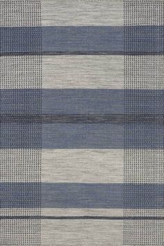 an area rug with blue and grey stripes