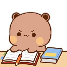 a brown teddy bear sitting at a desk with an open book and pen in front of it