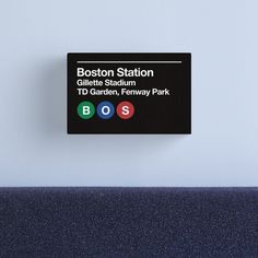 the boston station sign is posted on the wall