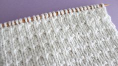 an up close shot of a white knitted cloth