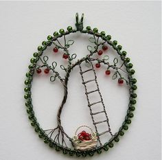 several pictures of various things made with wire and beads, including a tree ornament