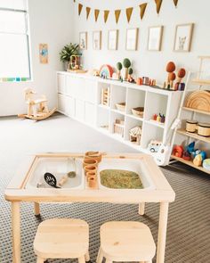 a child's play room with toys and shelves