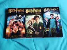 three harry potter movies on a blue blanket