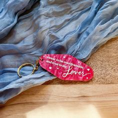 "Overdramatic & True" Unlock a little magic in your everyday life with our Lover Keychain, inspired by Taylor Swift's iconic album Lover! Perfect for all Swifties, this keychain features the heartfelt phrase, "Swear To Be Overdramatic and True To My Lover," adding a touch of whimsy to your collection. Product Details: Dimensions: Approx. 3.13 in x 1.46 in (excluding key ring) Design: One-sided design Color Options: Choose from three stunning marble colors with your choice of gold or white text. My Lover, Purple Marble, Cast Acrylic, Marble Colors, Pink Marble, Keychain Gift, Design Color, Key Rings, Key Ring