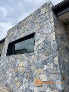 a building made out of rocks with a window