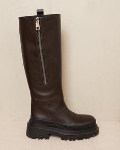 Banny trek knee high boot by Plan C in brown. Chunky lug sole in durable black rubber grounds this impressive knee high boot, crafted from a smooth brown calf leather. Decorative side zip can be fastened or worn open for a relaxed look. A sleek Italian interpretation of a utilitarian style to assert a stylish presence. Leather Upper, Leather Lining, Rubber Sole.Made in Italy. Utilitarian Style, Lug Sole, Black Rubber, Brown Boots, Knee High Boots, Side Zip, Calf Leather, Knee High, Rubber Sole