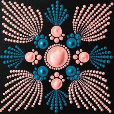 an artistic painting with blue and pink dots in the center on black canvase background