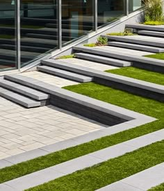 some steps and grass in front of a building