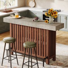 two stools sit at the center of a kitchen island