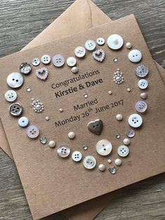 a card with buttons on it that says congratulations kristie and dare