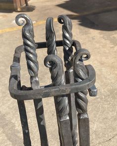 an iron fence with decorative designs on it