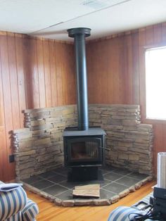 a living room with a wood burning stove