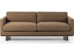 a brown couch sitting on top of a white floor