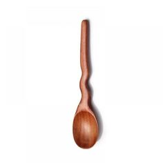 a wooden spoon sitting on top of a white surface