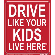 a red sign that says drive like your kids live here