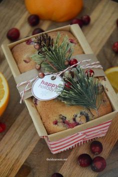 an orange and cranberry christmas cake in a box