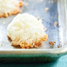 coconut cookies on a baking sheet ready to be eaten