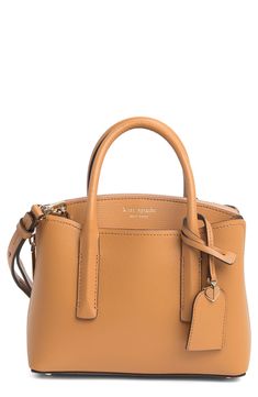 A structured silhouette brings preppy polish to a goes-with-anything satchel crafted from buttery-soft and smooth leather. 8.5"W x 6.25"H x 3.25"D; 3" handle drop; 23" strap drop Protective metal feet Leather Imported Mini Satchel Bag, Leather Satchel Handbags, Satchel Handbags, Satchel Bag, Leather Mini, Leather Satchel, Kate Spade New York, Satchel Bags, Smooth Leather