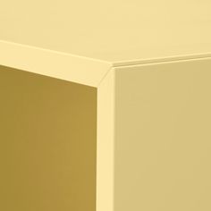 a close up view of the corner of a white and gold colored cabinet with one door open