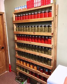 a wooden shelf filled with lots of jars