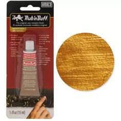 the golden metallic paint is being used to create this gold - colored crafting material