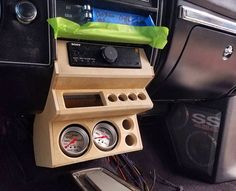 the inside of a car with various gauges and other electronic equipment in its compartment