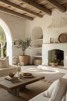 a living room filled with furniture and a fire place in the middle of a room