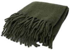 a green blanket with fringes on it