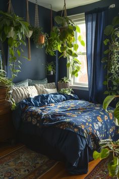 a bedroom with blue walls and plants hanging from the ceiling, along with a bed