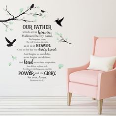 a pink chair sitting in front of a wall with a quote on it that says, our father which are in heaven