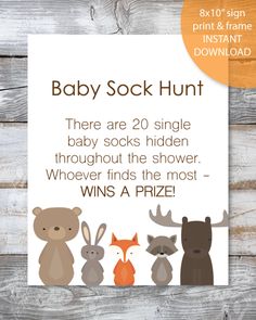 the baby sock hunt is on display in front of a wooden background