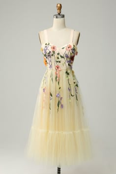 a yellow dress with flowers on it