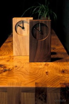 a wooden clock sitting on top of a table