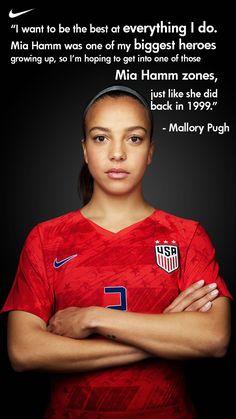 a female soccer player with her arms crossed