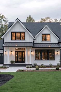 a white house with black trim and windows