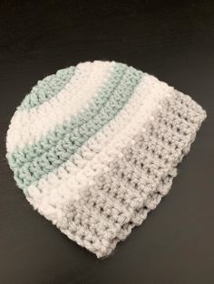 a crocheted hat sitting on top of a table