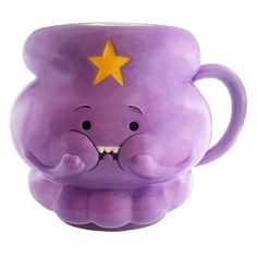 a purple elephant mug with a yellow star on it's forehead and its mouth open