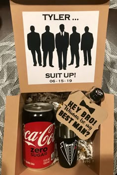 an open box with some soda and other items in it that include a sign saying, tyler suit up