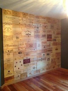 a room with wood flooring and walls covered in wine corks on the wall