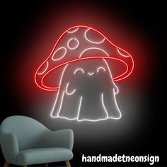 a mushroom shaped neon sign is lit up against a black background with a chair in the foreground