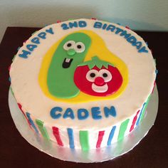 a birthday cake with two cartoon characters on it