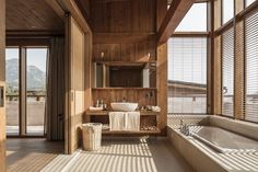 a large bathroom with wooden walls and flooring