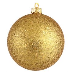 a gold christmas ornament hanging on a white background