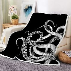 an octopus blanket sitting on top of a couch