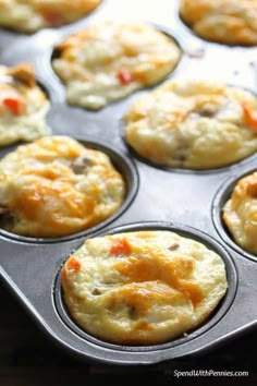 a muffin tin filled with some tasty looking food