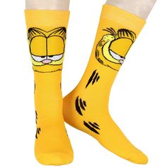 Celebrate Garfield's playful personality with these Garfield Comics Men's Novelty Garfield The Cat Big Face Character Orange Rib Knit Crew Socks. Featuring a bold design of the lasagna-loving cat, these vibrant socks display Garfield's fur stripes running down the sides. The fuzzy-textured cheeks add a fun, tactile detail to the look. Rib-knit cuffs keep the socks securely in place, preventing slipping or bunching as you show off your Garfield fandom. great for any occasion, they bring a whimsic Socks Display, Sock Display, Garfield The Cat, Socks Party, Garfield Comics, Iron Man Captain America, Mens Crew Socks, Marvel Iron Man, Face Characters