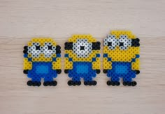 three lego minion figures made out of legos